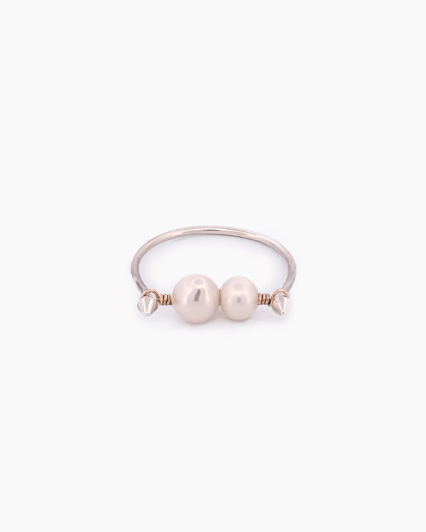 Two tone Silver and Gold ring with two pearls. A handmade minimal refined design with inspired by medieval adornment 