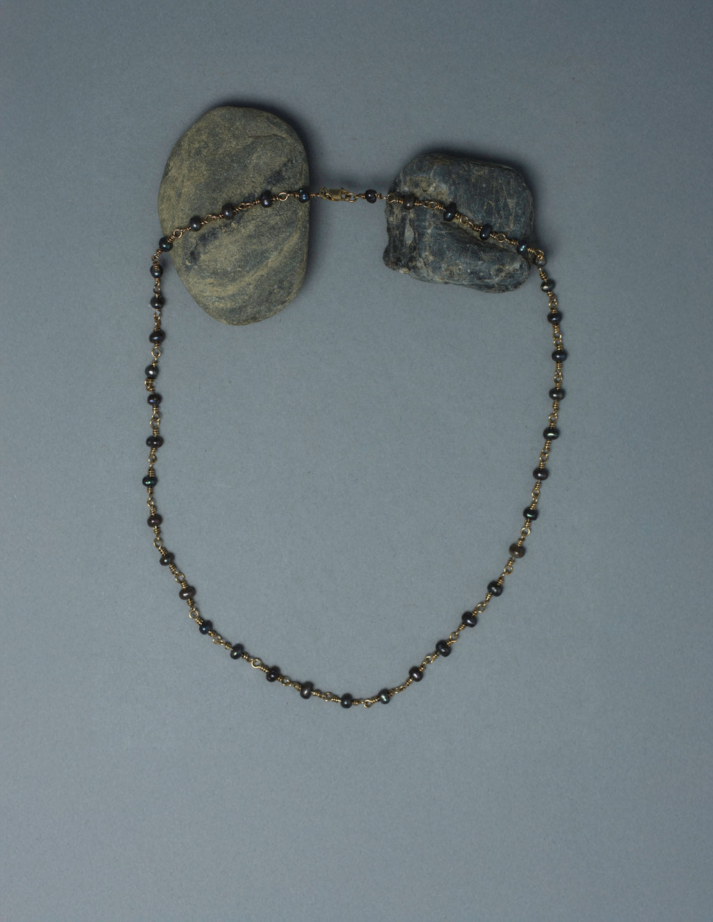 Close-up of handmade 9kt gold and black pearl gem chain, medieval-inspired wire-worked pearl necklace, AEJL jewellery