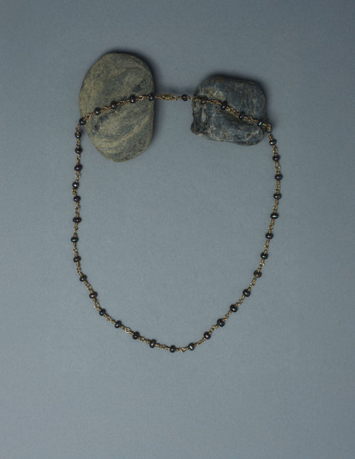 Close-up of handmade 9kt gold and black pearl gem chain, medieval-inspired wire-worked pearl necklace, AEJL jewellery