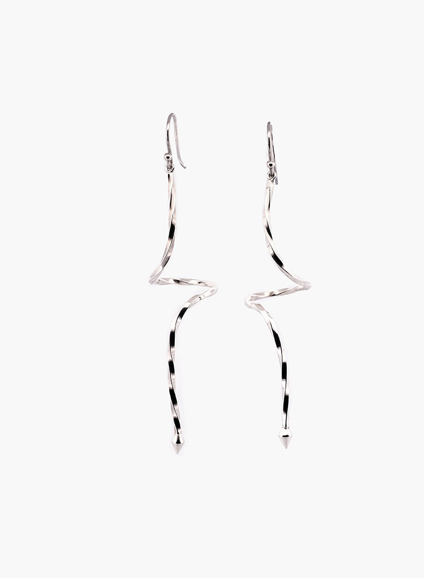 Pair of silver spiraling drop earrings on a white background