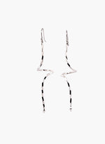 Load image into Gallery viewer, Pair of silver spiraling drop earrings on a white background
