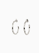 Load image into Gallery viewer, Pair of twisted silver hoop earrings on a white background
