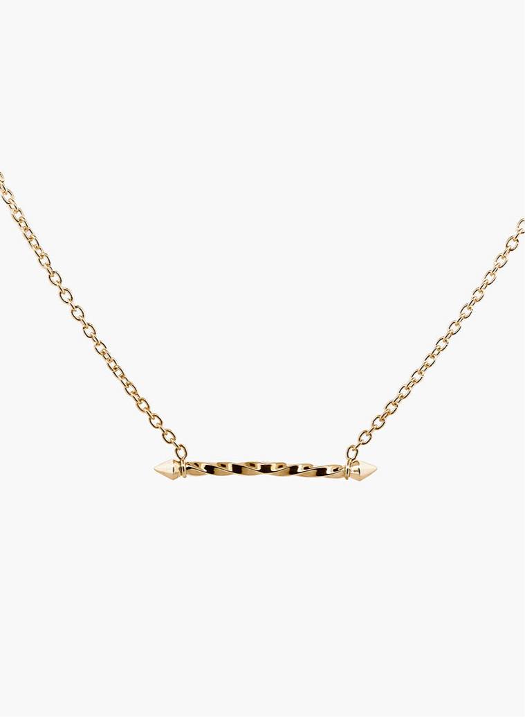 Gold necklace with a twist pendant and spikes on a white background